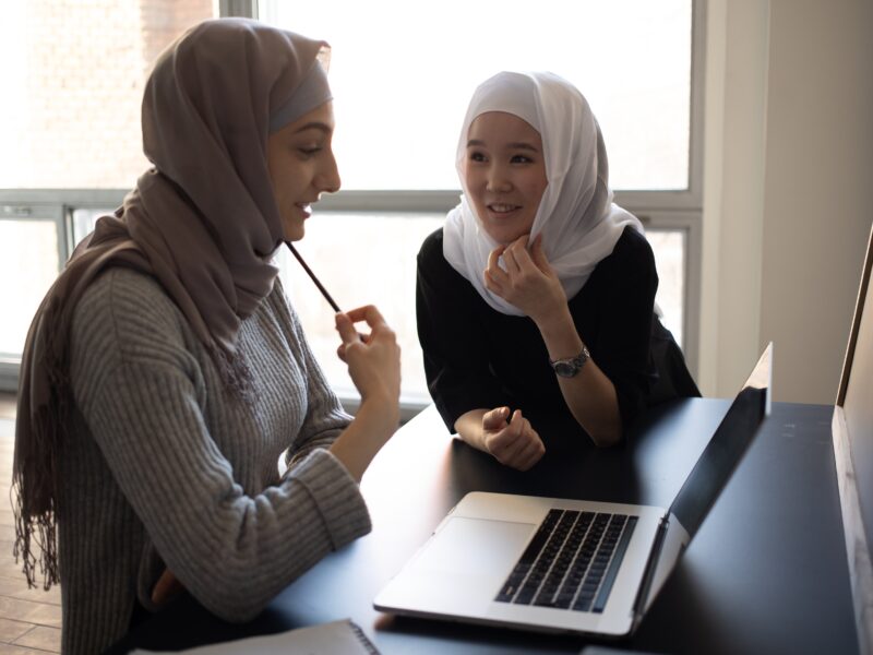 Two women with hijab talking